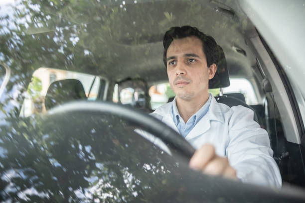 Latin doctor driving his car