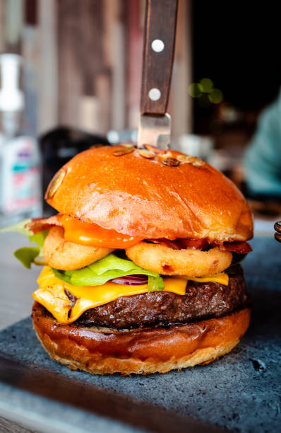 Freshly flame grilled bacon cheeseburger and fries at the restaurant