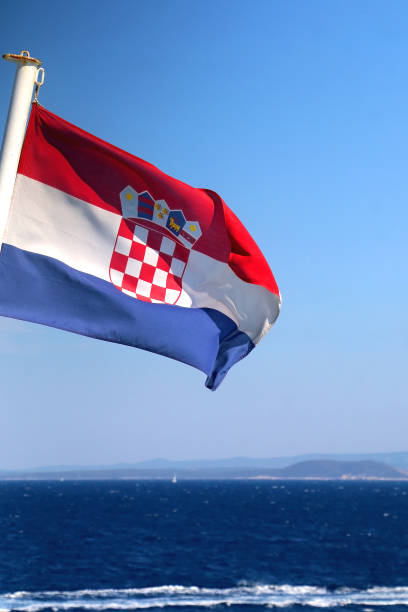 istock Croatian Flag and Adriatic Sea 1366749410