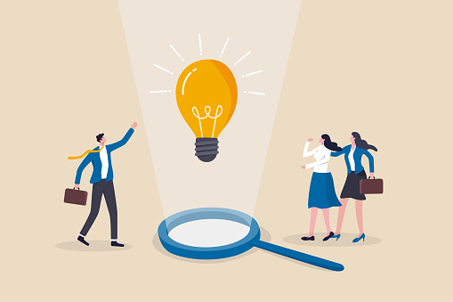 Business insights intelligence information for competitive advantage and win competition, discover business solution concept, business people team looking at lightbulb floating from magnifying glass.