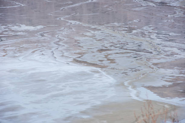 istock Muddy waters in a decantation pond. Toxic residuals from a copper mine decating in a settling basin 1366749637