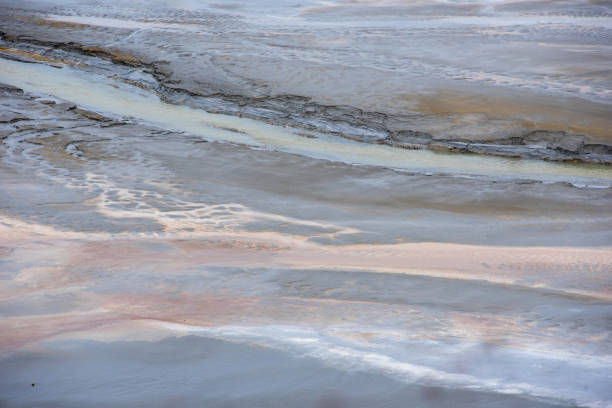 istock Muddy waters in a decantation pond. Toxic residuals from a copper mine decating in a settling basin 1366749644