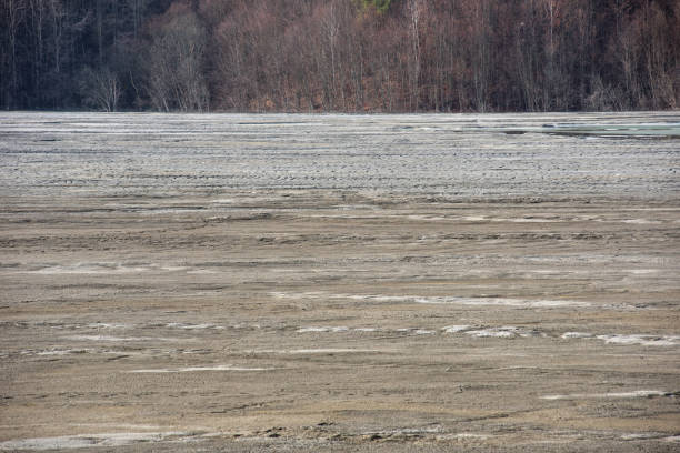 istock Muddy waters in a decantation pond. Toxic residuals from a copper mine decating in a settling basin 1366749655