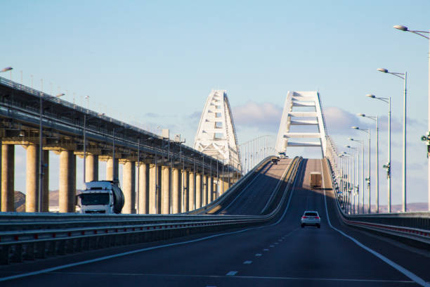 ponte di crimea, penisola di crimea. costruito da putin - industry water sky architecture foto e immagini stock