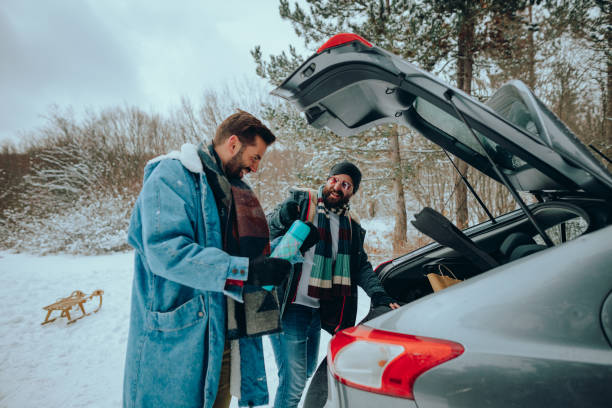 istock Two man taking a road trip on a snowy winter day in nature 1366749954