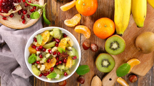 istock bowl of fruit salad and ingredients 1366750937