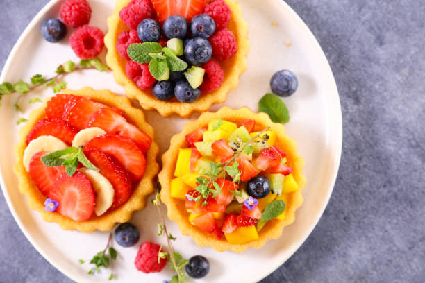 istock fruit tart,  tartlet with berries fruits 1366750977