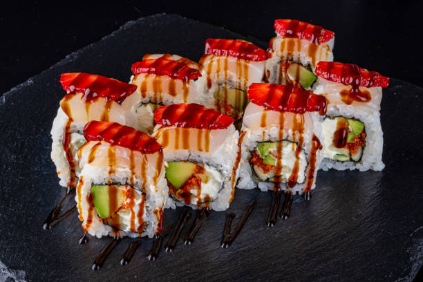 istock Set fresh delicious Japanese sushi on dark background 1366751166