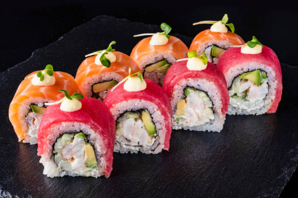 istock Set fresh delicious Japanese sushi on dark background 1366751215