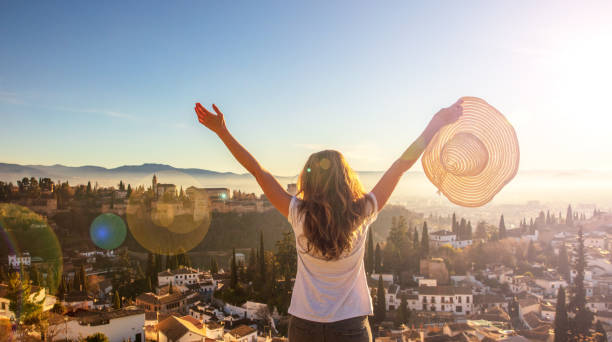 woman tourist happy looking at Alhambra view- Andalusia in Spain woman tourist happy looking at Alhambra view- Andalusia in Spain granada stock pictures, royalty-free photos & images