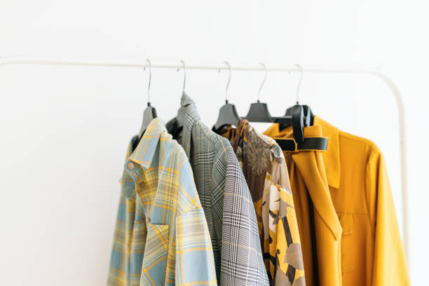 Capsule of casual clothes in yellow and gray colors closeup stock photo