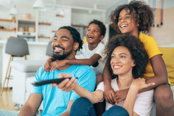 istock Family watching television 1366752578