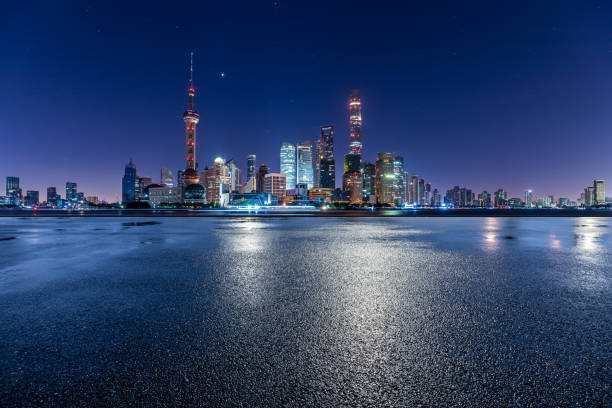 Asphalt road and city skyline with modern commercial buildings in Shanghai stock photo