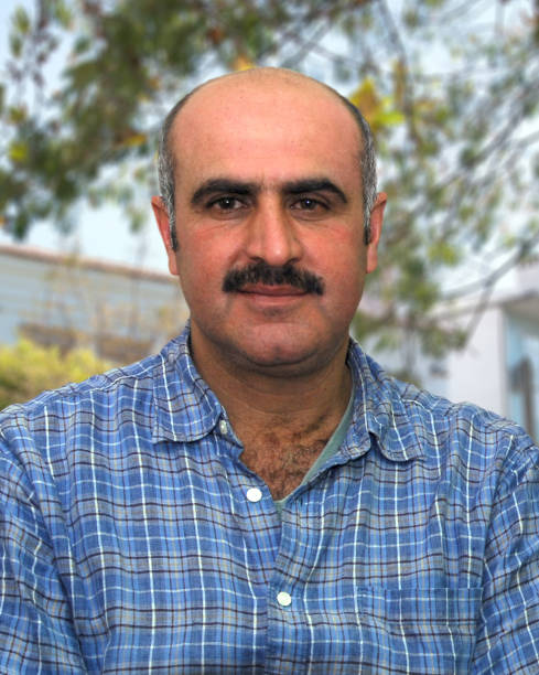 istock Portrait of bald man with mustache 1366753979