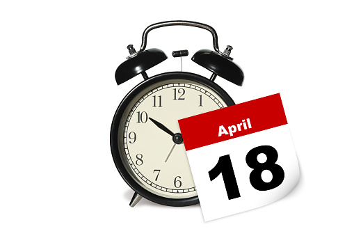 Tax day alarm clock note reminder calendar April 18