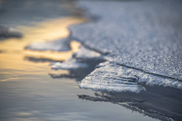 Beautiful ice on a winter mountain river stock photo