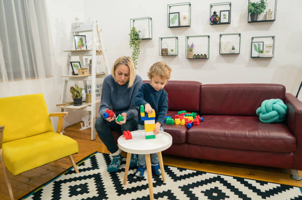 istock Mother and son playing with colorful blocks 1366754954