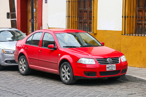 Oaxaca, Mexico - May 25, 2017: Red sedan Volkswagen Jetta (A4) in a city street.
