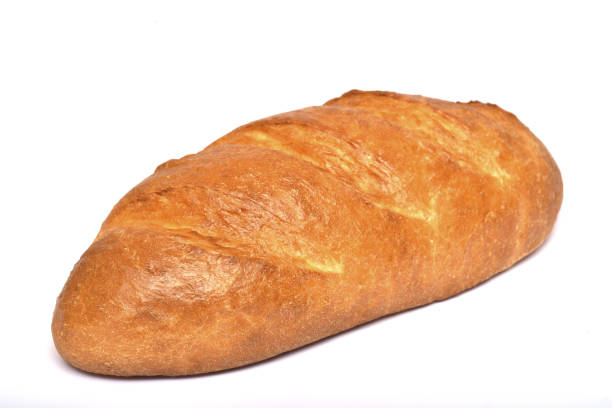 Loaf of white bread on a white plate. - fotografia de stock