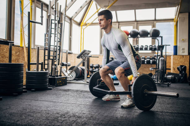 istock Man body building in gym 1366757454