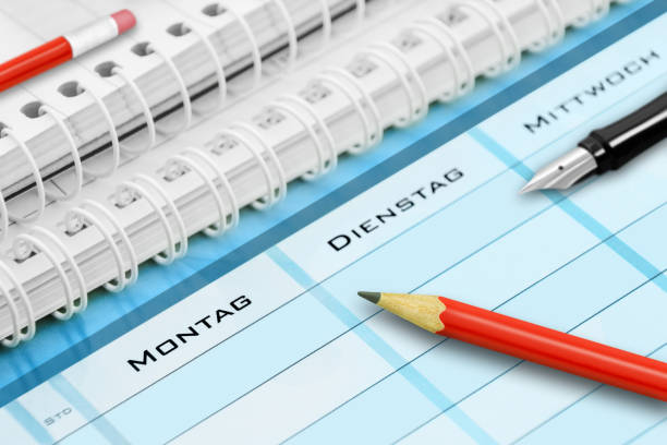 German school timetable and pencils closeup Monday Tuesday Wednesday