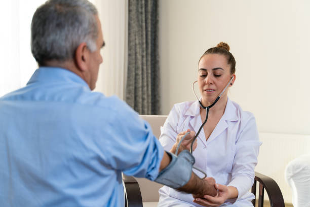 istock Doctor checking patient's blood pressure at home 1366759716