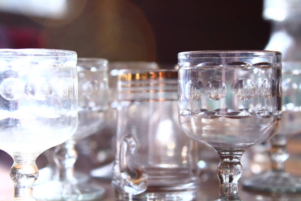 istock Old empty dusty glasses on the table. Close-up. Background. 1366762281