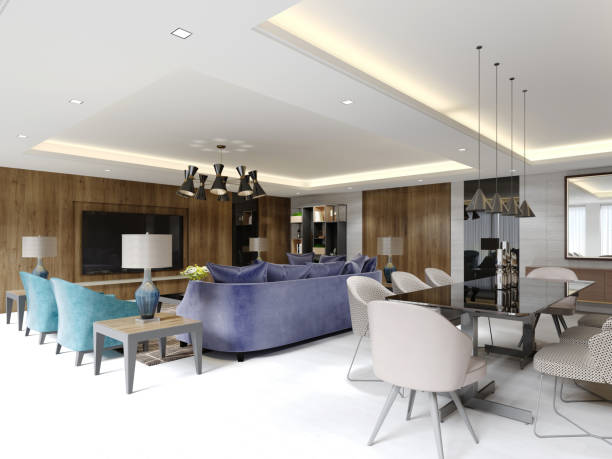 istock Studio apartment with open area living room and kitchen with dining table with wood paneling on the walls and light green and purple furniture. 1366768589