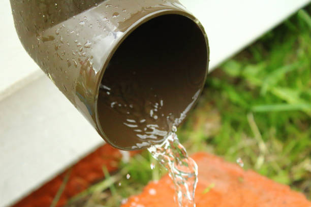 istock A plastic drain with running water. Water jet. Close-up. 1366769825