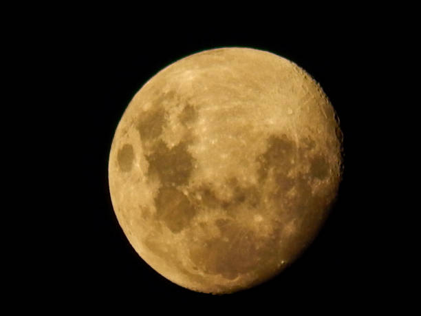 istock moon at sunset in the field 1366772195