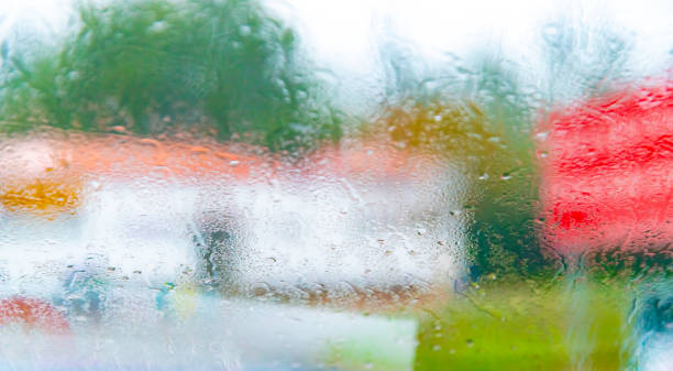istock Raindrops on glass window with beautiful bokeh 1366773477
