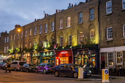 Upper street, the central thoroughfare of Islington at night, London, England, UK