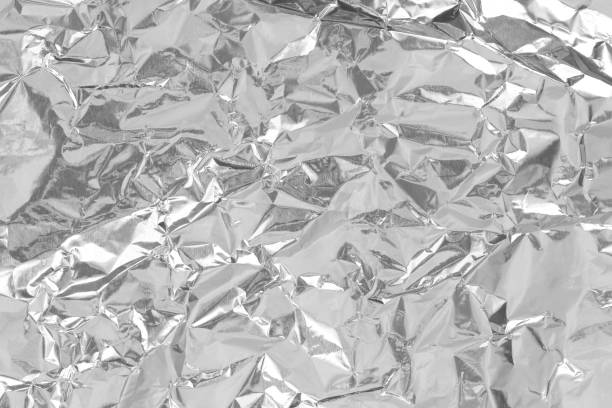 istock Silver foil leaf shiny texture, abstract grey wrapping paper for background and design art work. 1366775250
