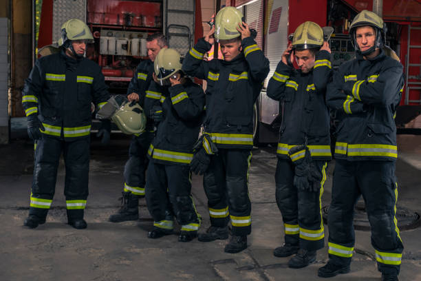 istock Group of firefighters standing confident with arms crossed. Firemen ready for emergency service. 1366775446