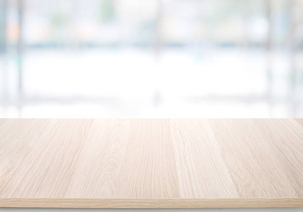 istock Select tive focus.Empty wood table top on blur abstract window glass background. 1366777169