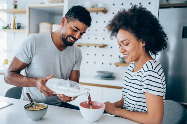 istock Couple having breakfast at home. 1366778229