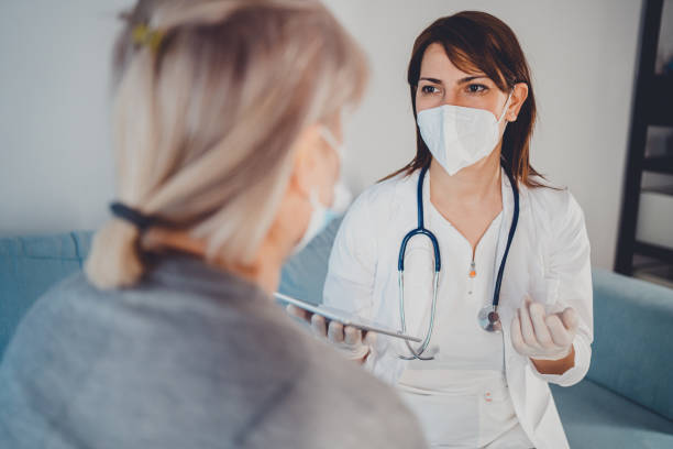 istock Female doctor at home visit. 1366778237