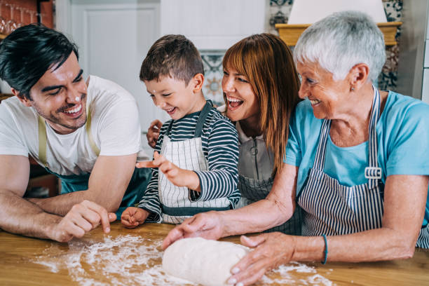 istock Multi-generation family having fun in the kitchen. 1366778249