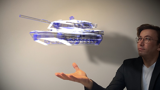 Arms Dealer showing next-generation hologram technology held in his hand. Augmented virtual reality is about to become a part of life in the near future. The new design technology enables all parts of the vehicles to be designed interactively, combining and separating them. / You can see the animation movie of this image from my iStock video portfolio. Video number: 1366231280