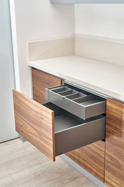 istock Minimalist style kitchen of walnut wood and gray color with acrylic solid surface countertop 1366782362
