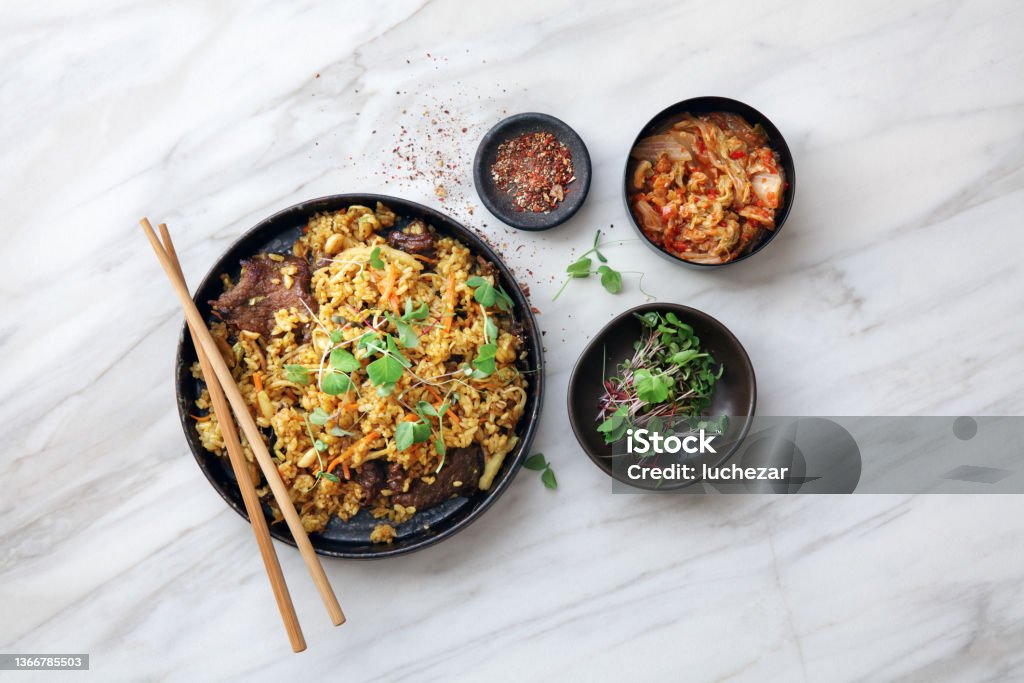 Thai Beef Fried Rice Thai Beef Fried Rice. Flat lay top-down composition on marble background. Stir-Fried Stock Photo