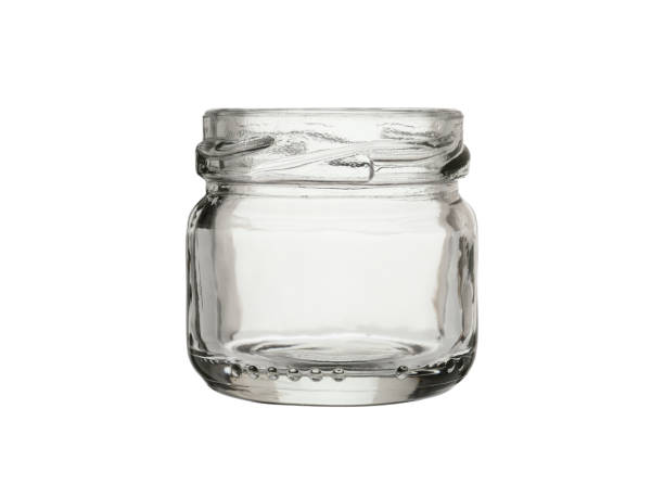istock Empty glass jar for canned food and jam, low shape. Isolated on a white background. 1366786210