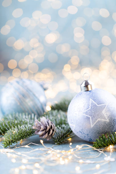 istock Christmas spruce with ball and blurred shiny lights. 1366787758