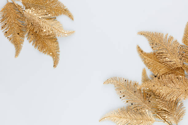 istock Palm gold leaf on blue background. Palm leaf, Flat lay and top view. 1366787933