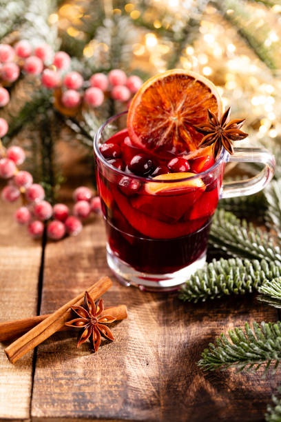 istock Christmas mulled wine with spices on a wooden rustic table. 1366787938