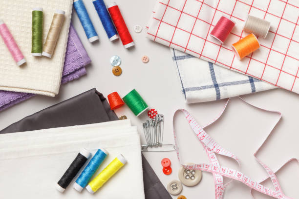 istock Fabric and threads on a gray background.Sewing tools and accessories. 1366788618