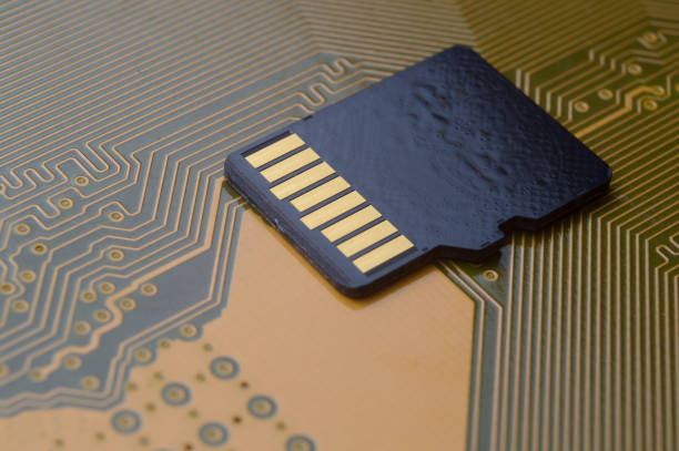 the black micro sd card lies on the microcircuit. close-up