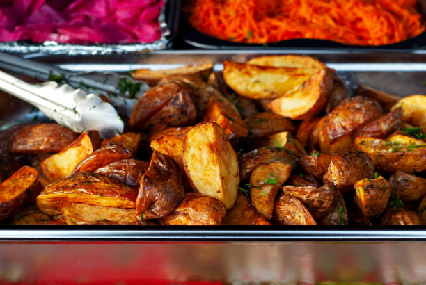 Potatoes baked on the fire. Sliced potatoes fried with peel.