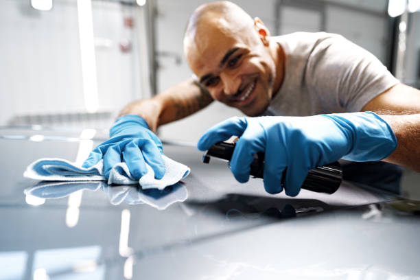 istock African American man car service worker applying nano coating on a car 1366796072