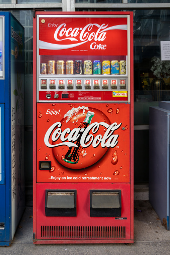 Hong Kong - January 25, 2022 : Coca-Cola Vending Machine in Wan Chai, Hong Kong. Vending machines are very convenient way of fast buying drinks on street.